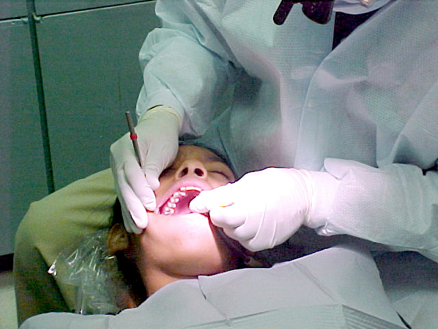 Dentist working on child's teeth