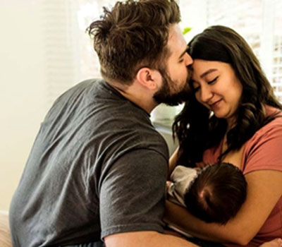 Parents holding a baby